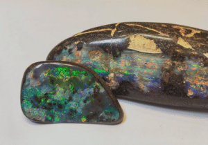 Large boulder opal with a small boulder opal in the foreground